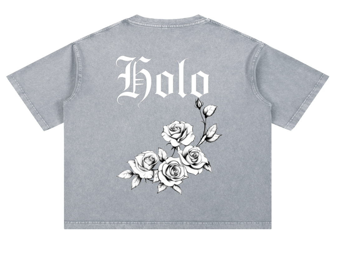 HOLO Drop 001 — washed grey heavyweight tee with blackletter Holo lettering and tattoo-style rose cluster